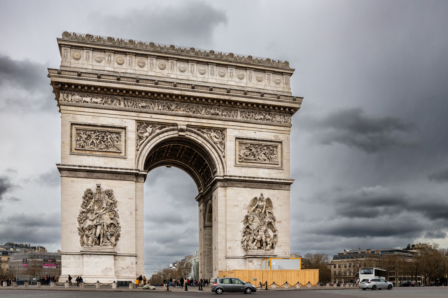 Capture of Arc de Triomphe, Paris on a cloudy day, showcasing historic architectural grandeur.